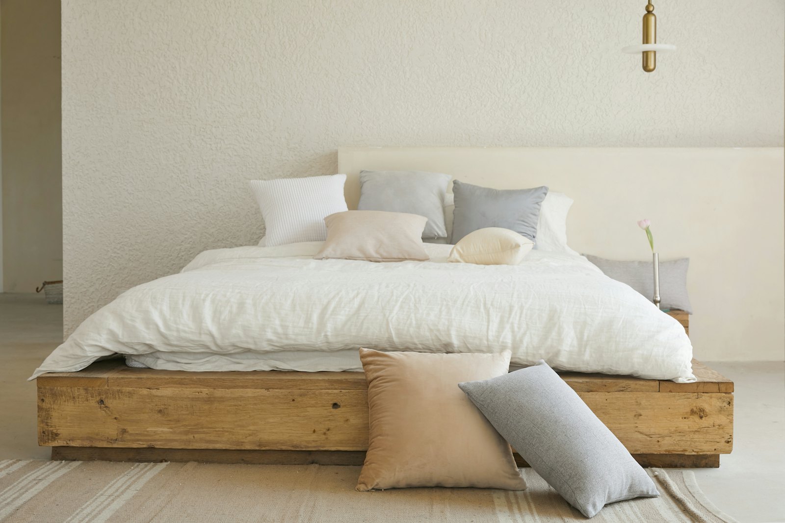 Bedroom with a timber platform bed and linen